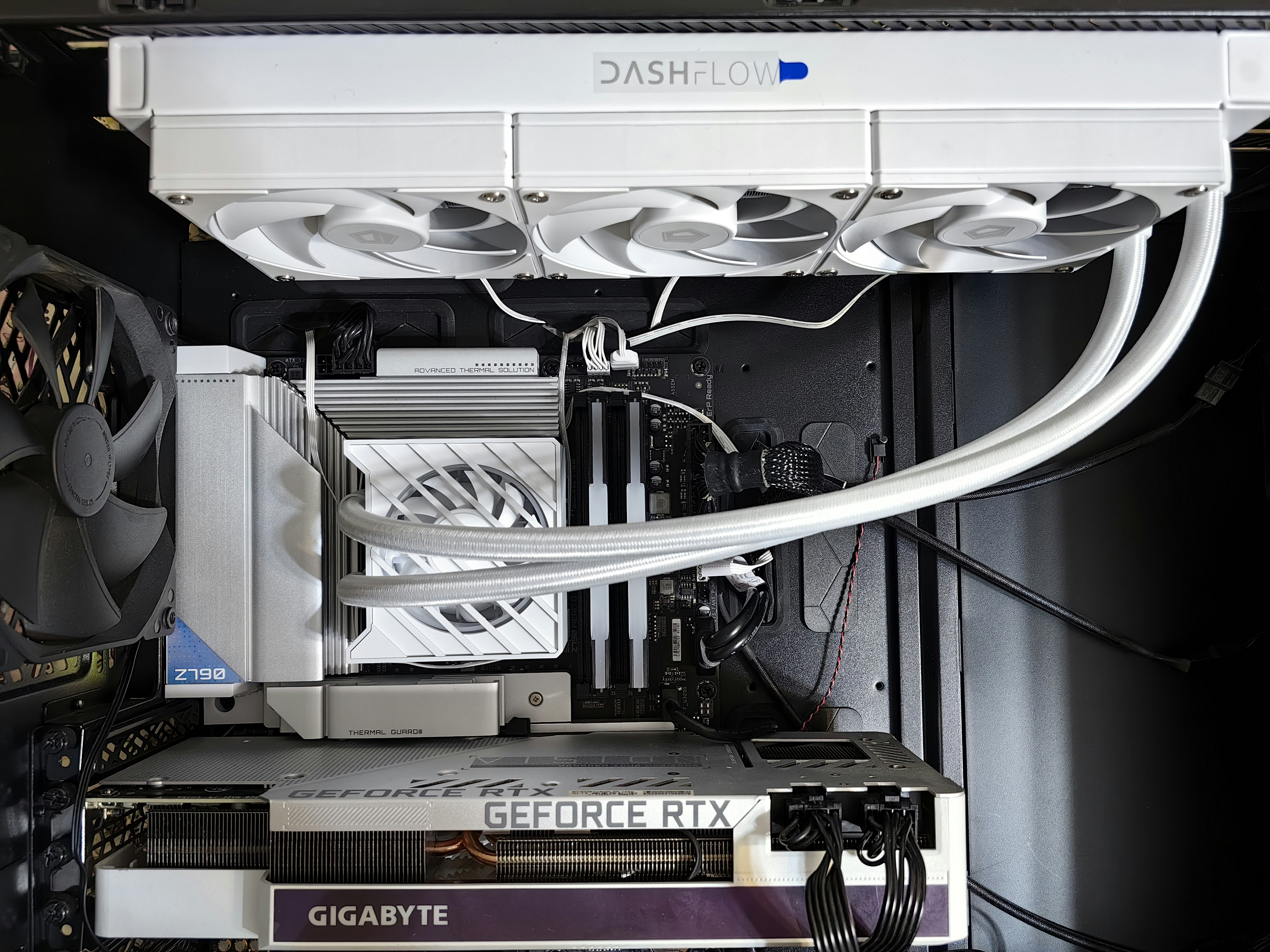 The inside of a computer case with a lot of wires