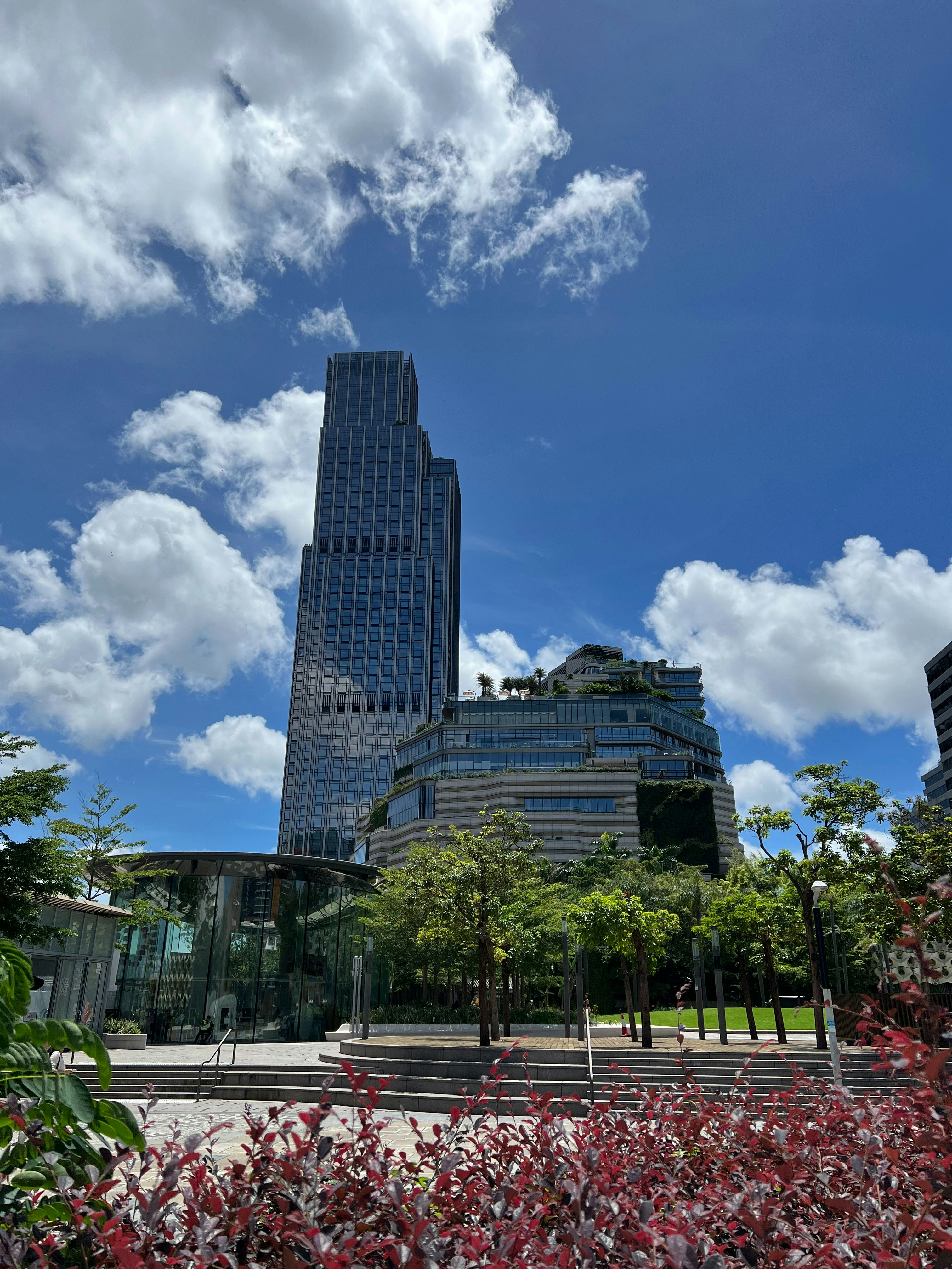 A tall building towering over a city filled with tall buildings
