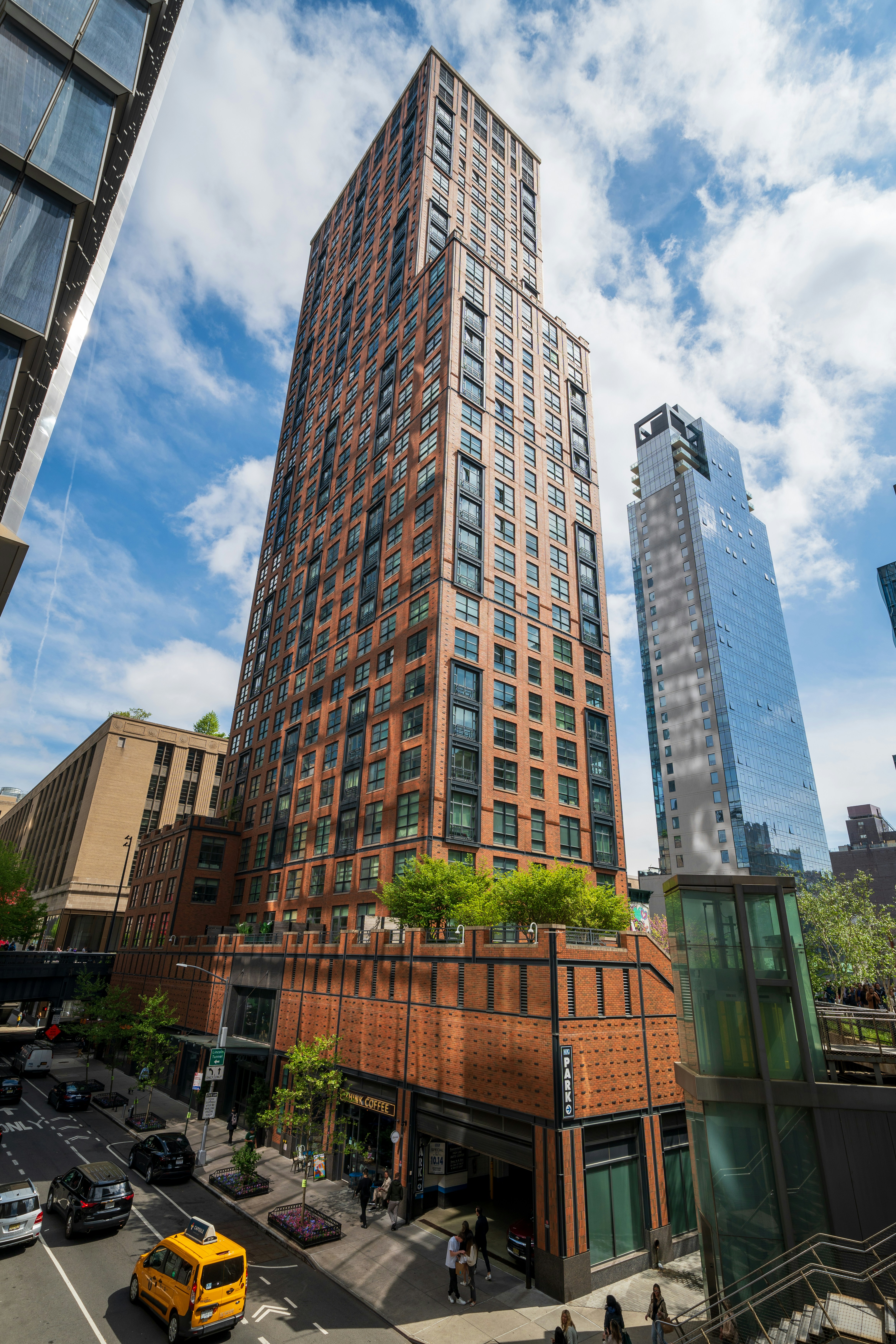 A city street with tall buildings and cars