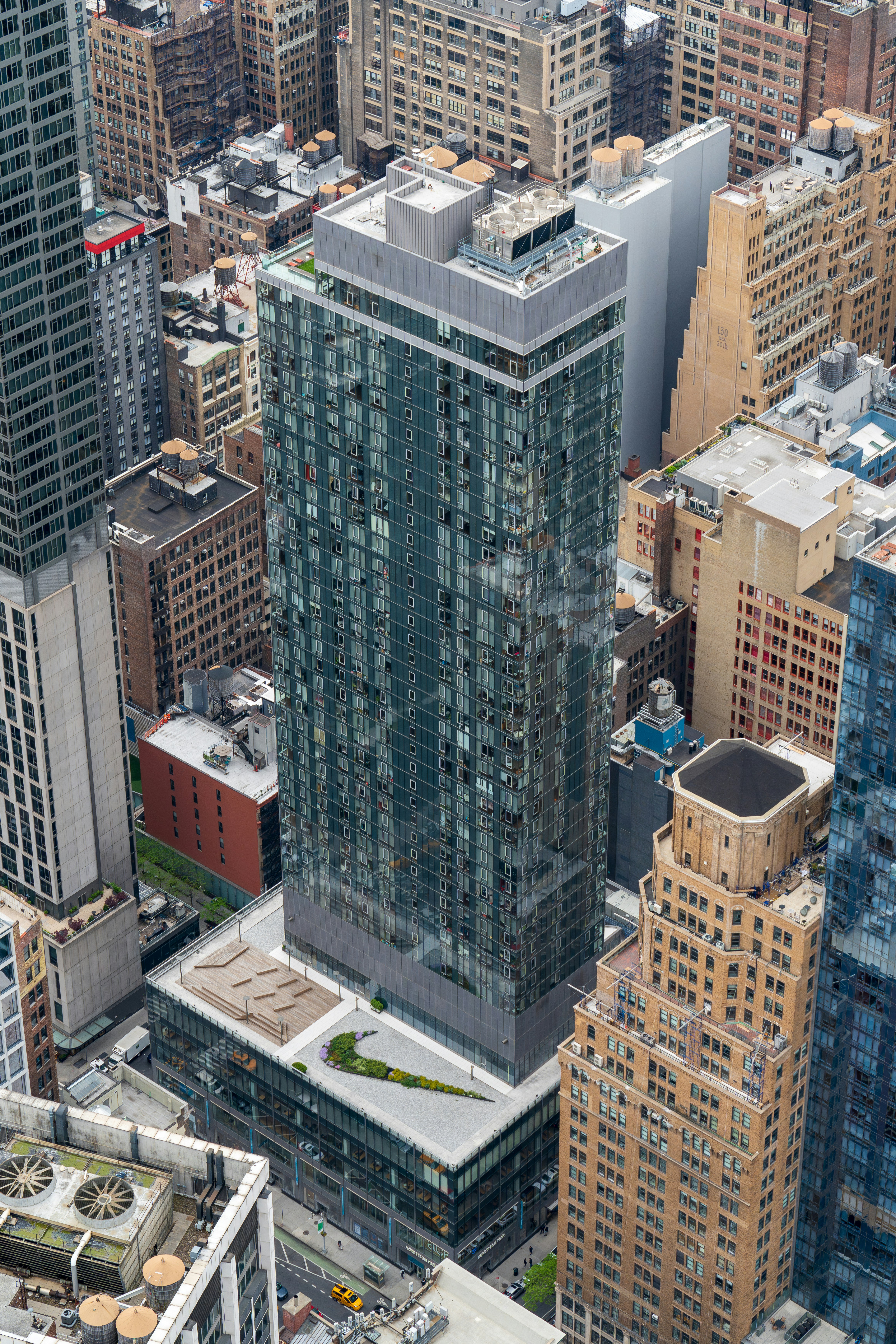 An aerial view of a city with tall buildings
