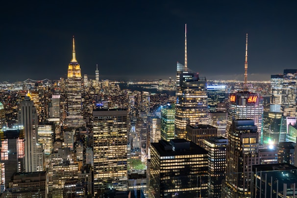 A view of a city at night from the top of a building