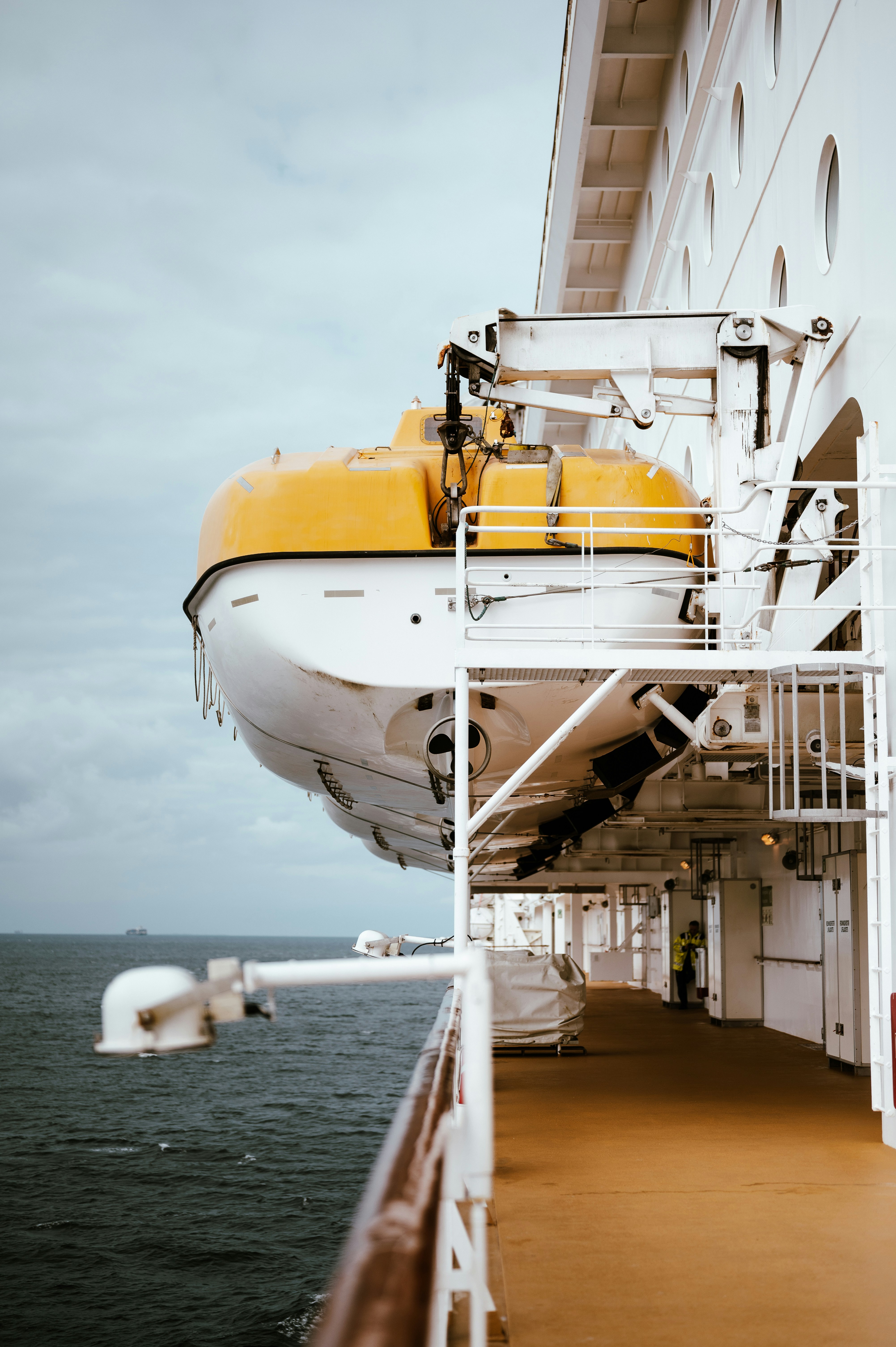A large white and yellow boat in the water