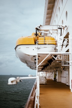 A large white and yellow boat in the water