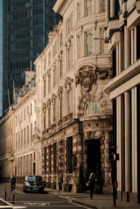 A city street with tall buildings in the background