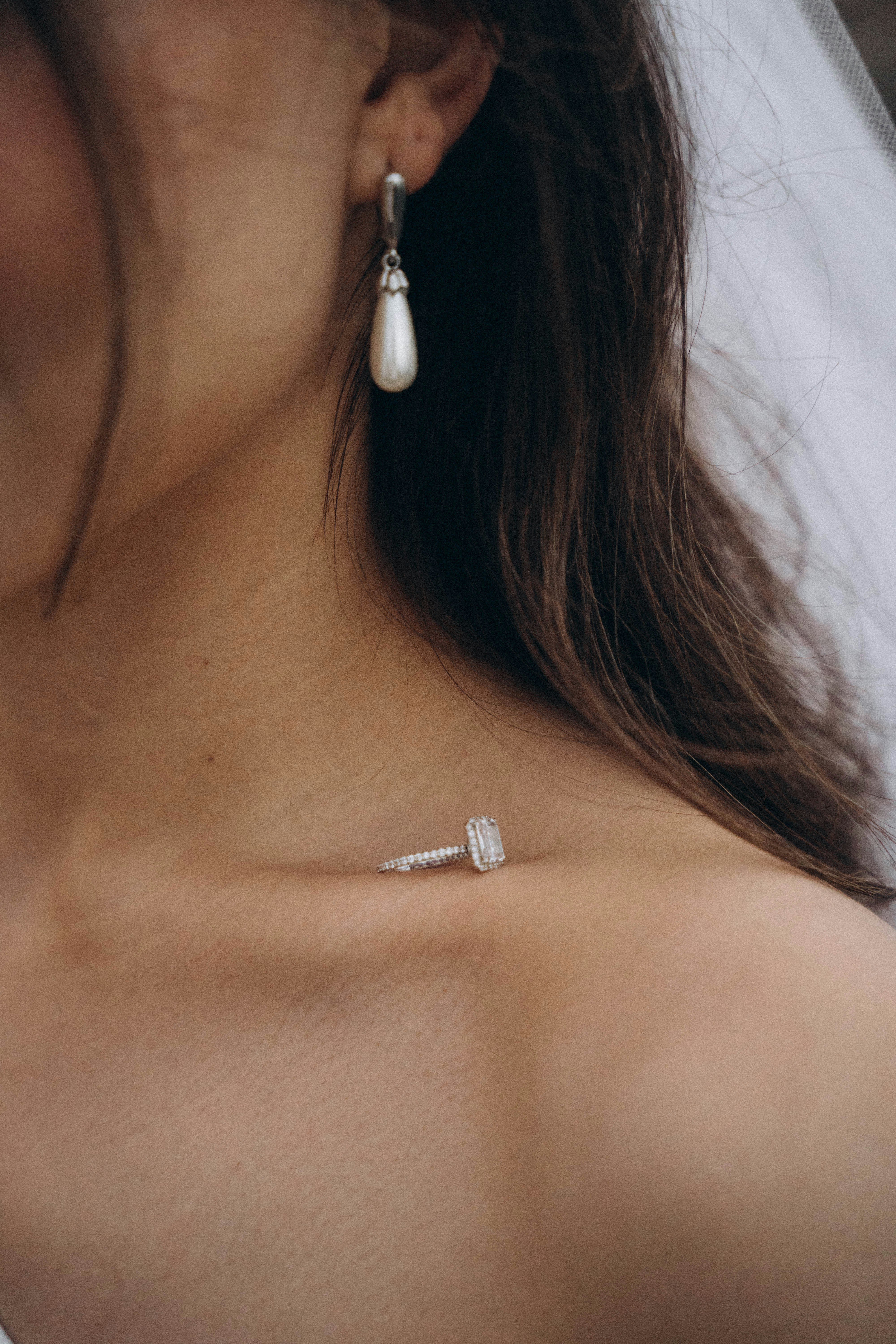 A close up of a woman wearing a wedding dress