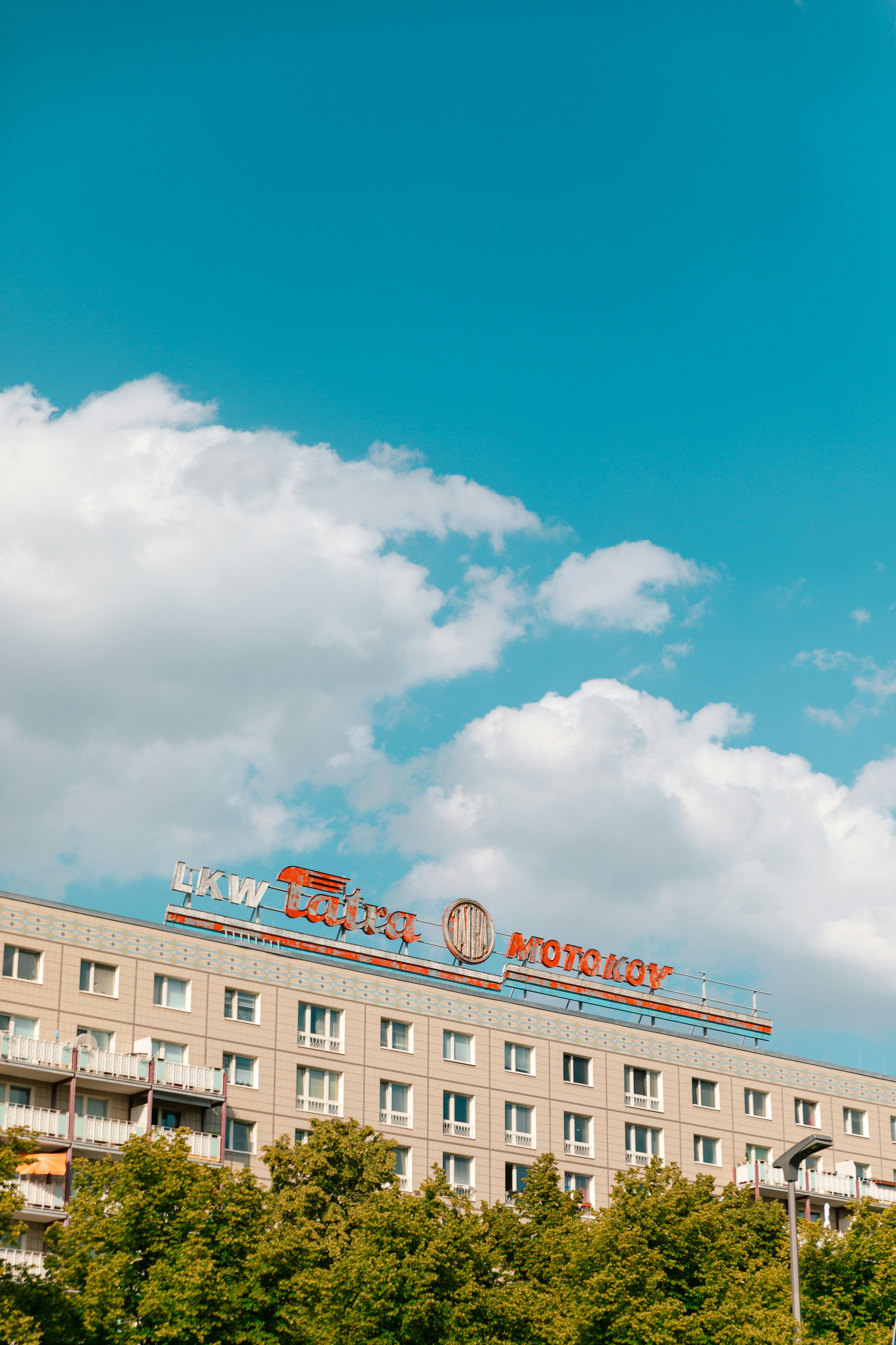 A tall building with a sign on top of it