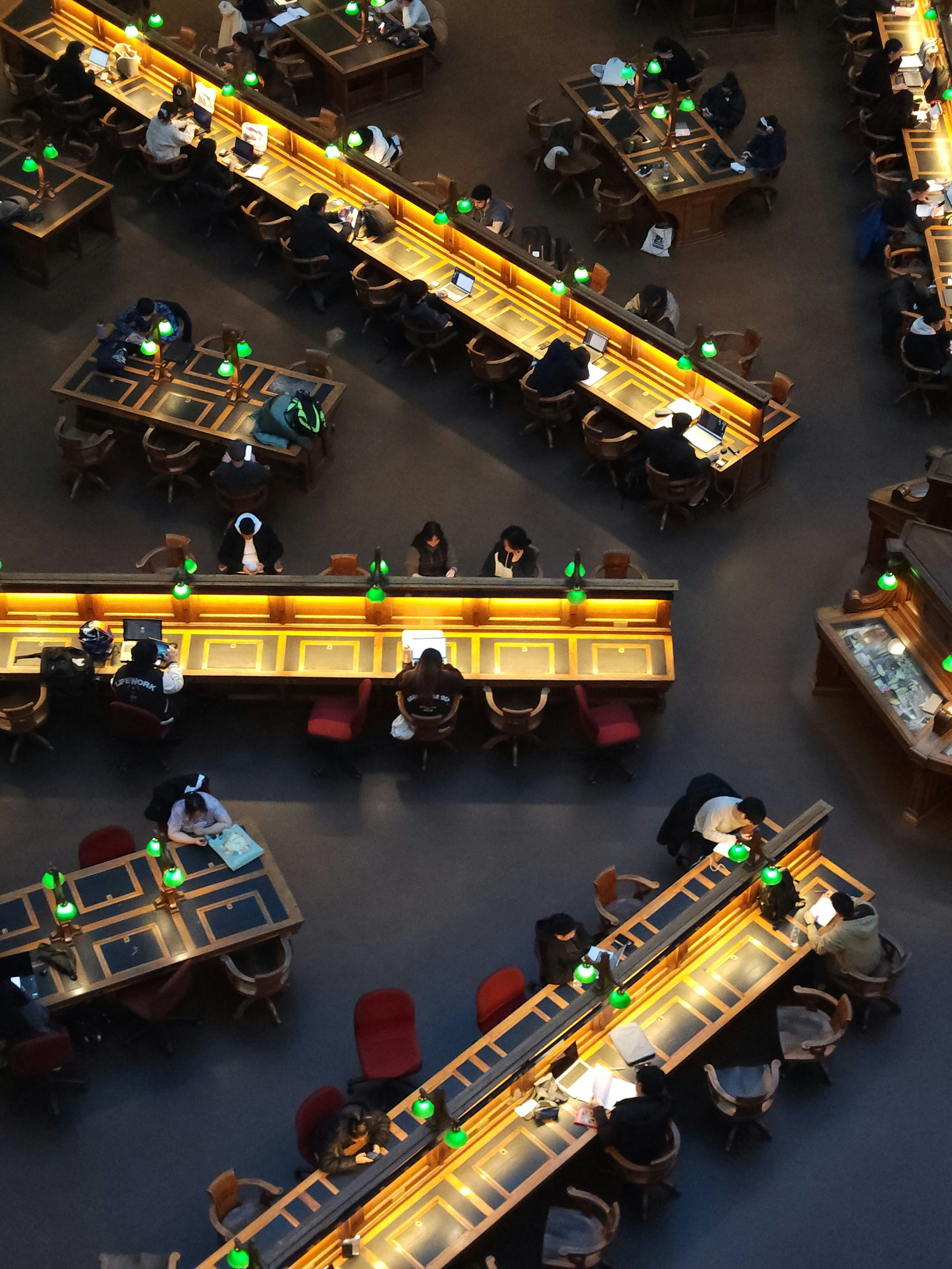 A group of people sitting at tables in a restaurant