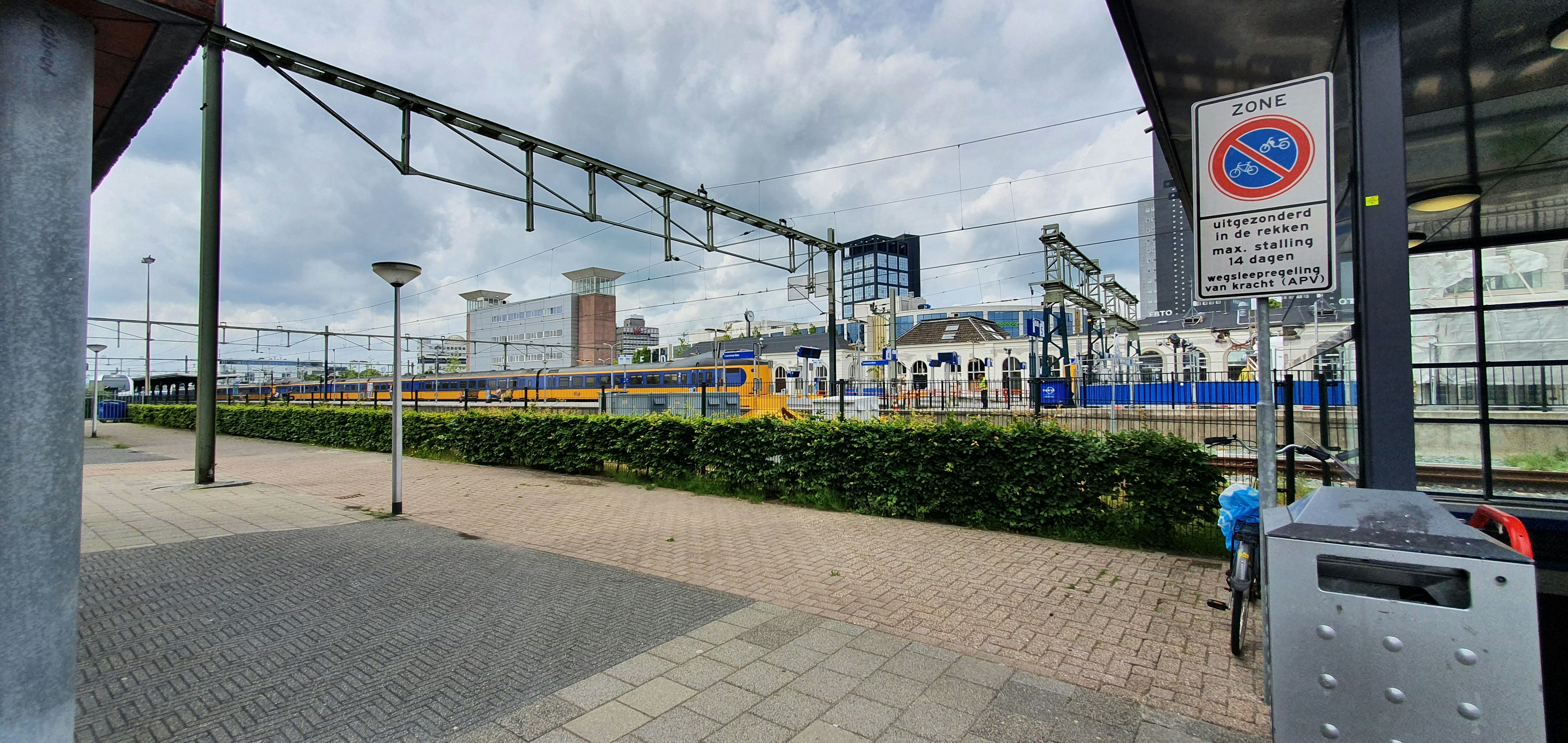 A train station with a train on the tracks