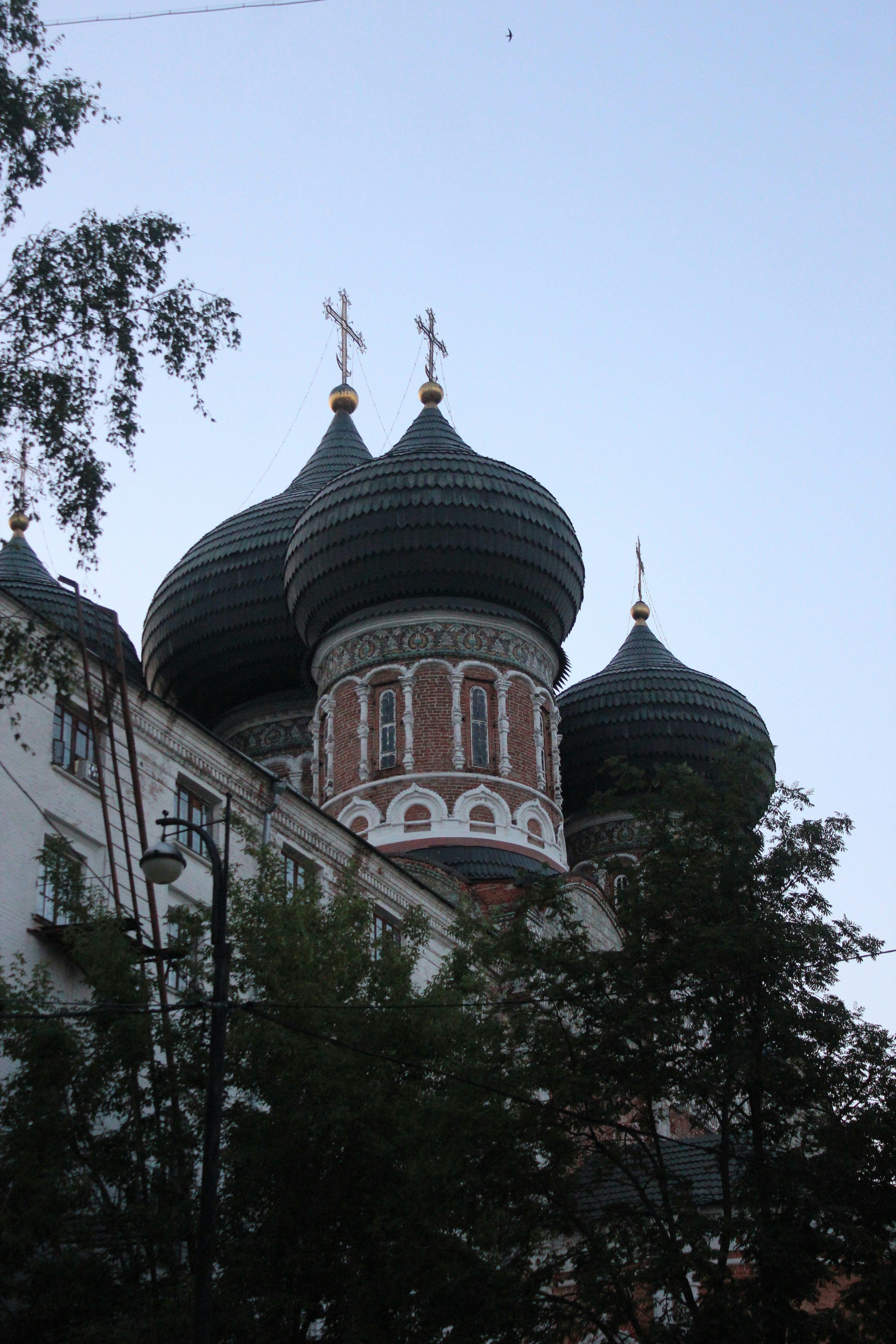 A large building with a cross on top of it