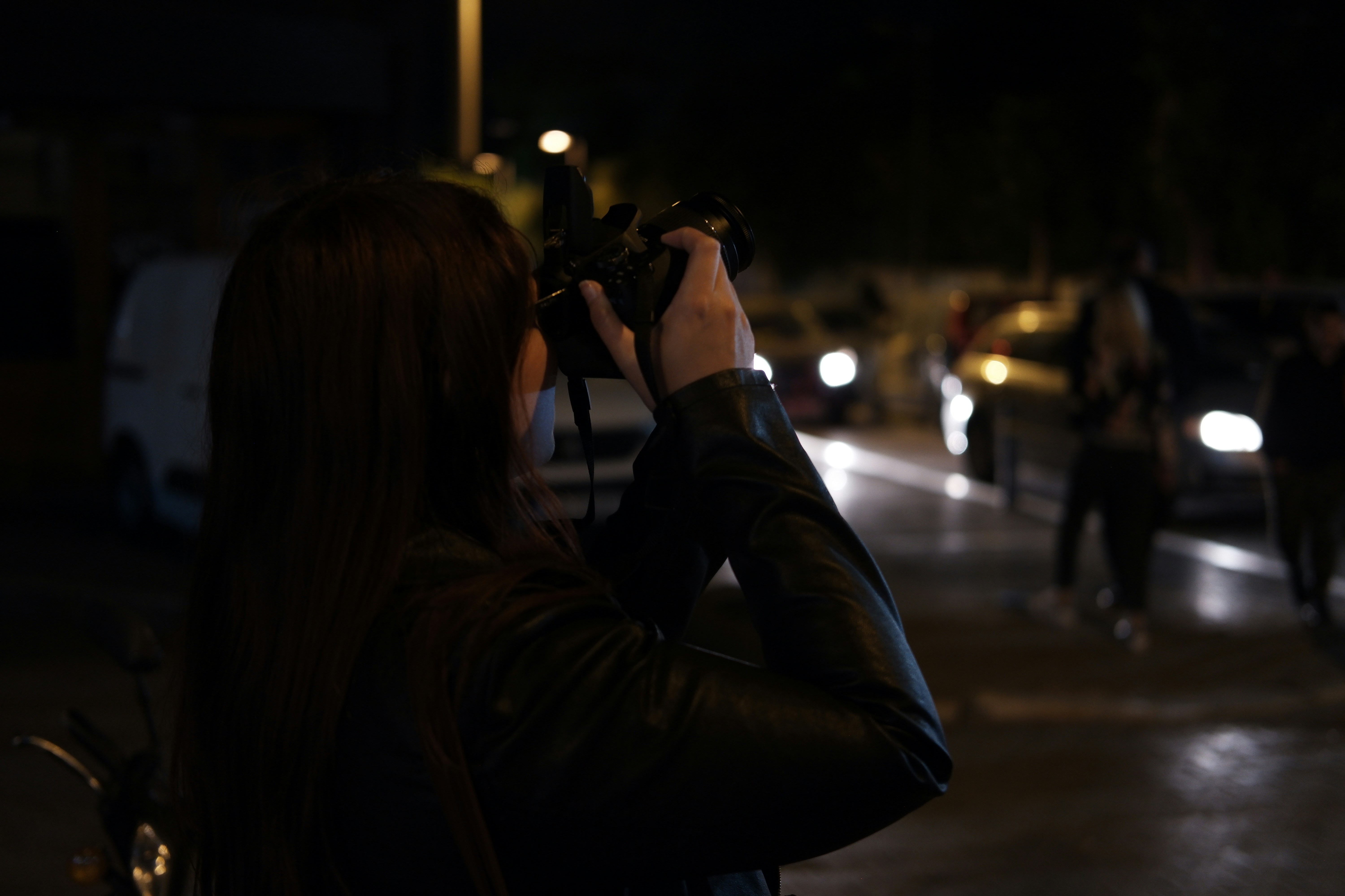 A woman taking a picture of a group of people