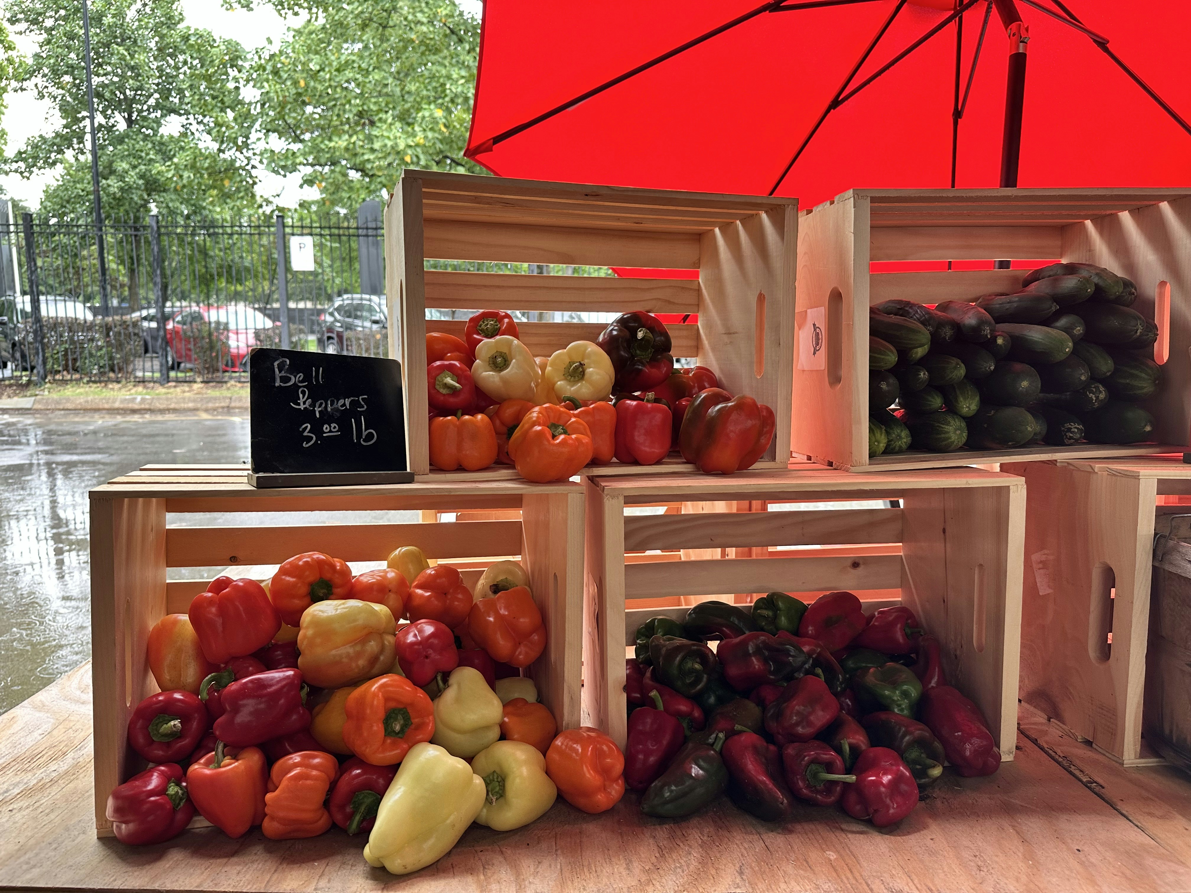 A pile of fruit sitting on top of a wooden table