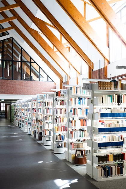 Floor-to-ceiling bookshelves in a grand library