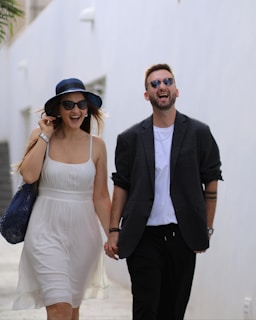 A man and a woman walking down a street