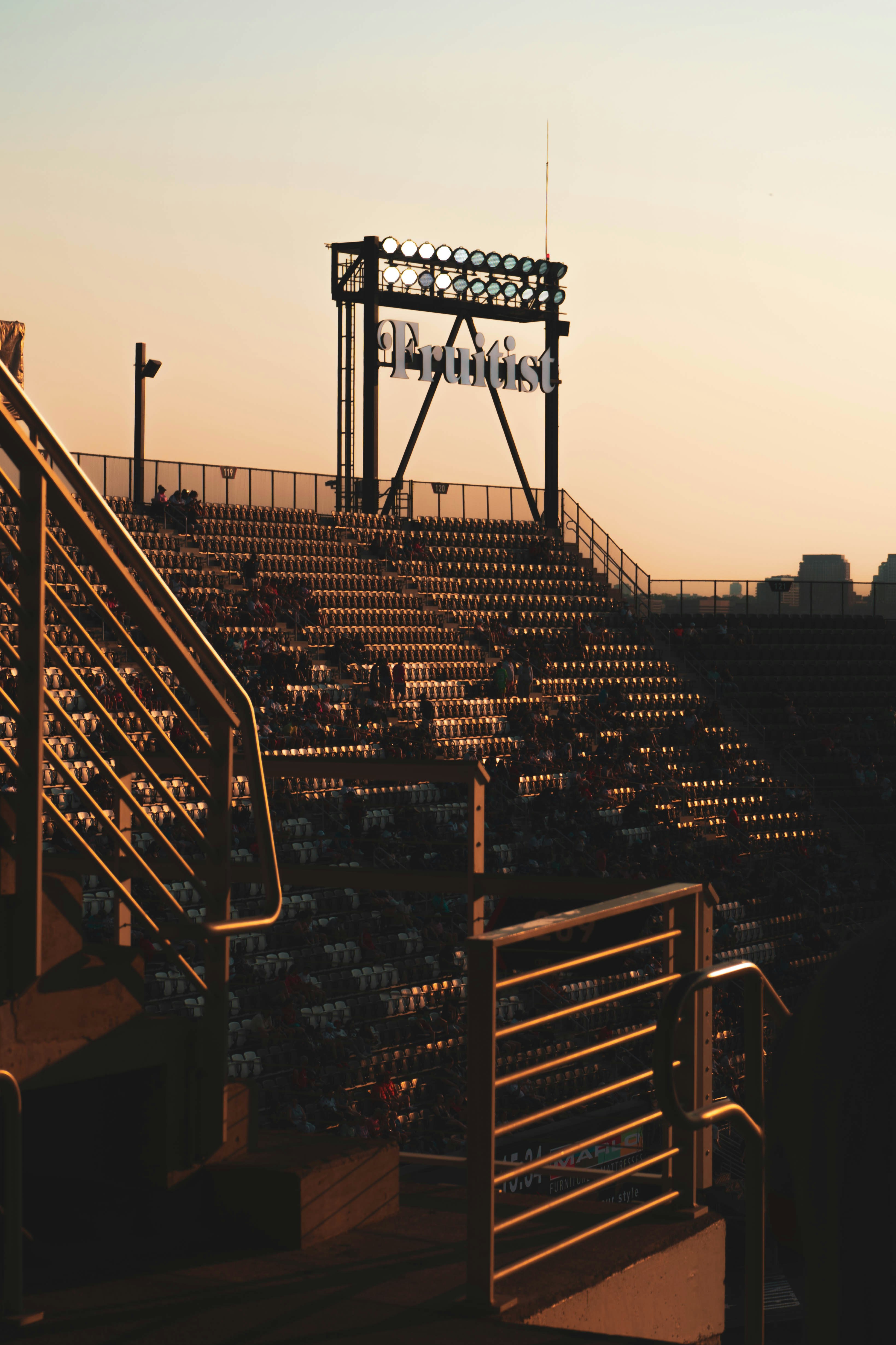 A baseball stadium with a view of the bleachers