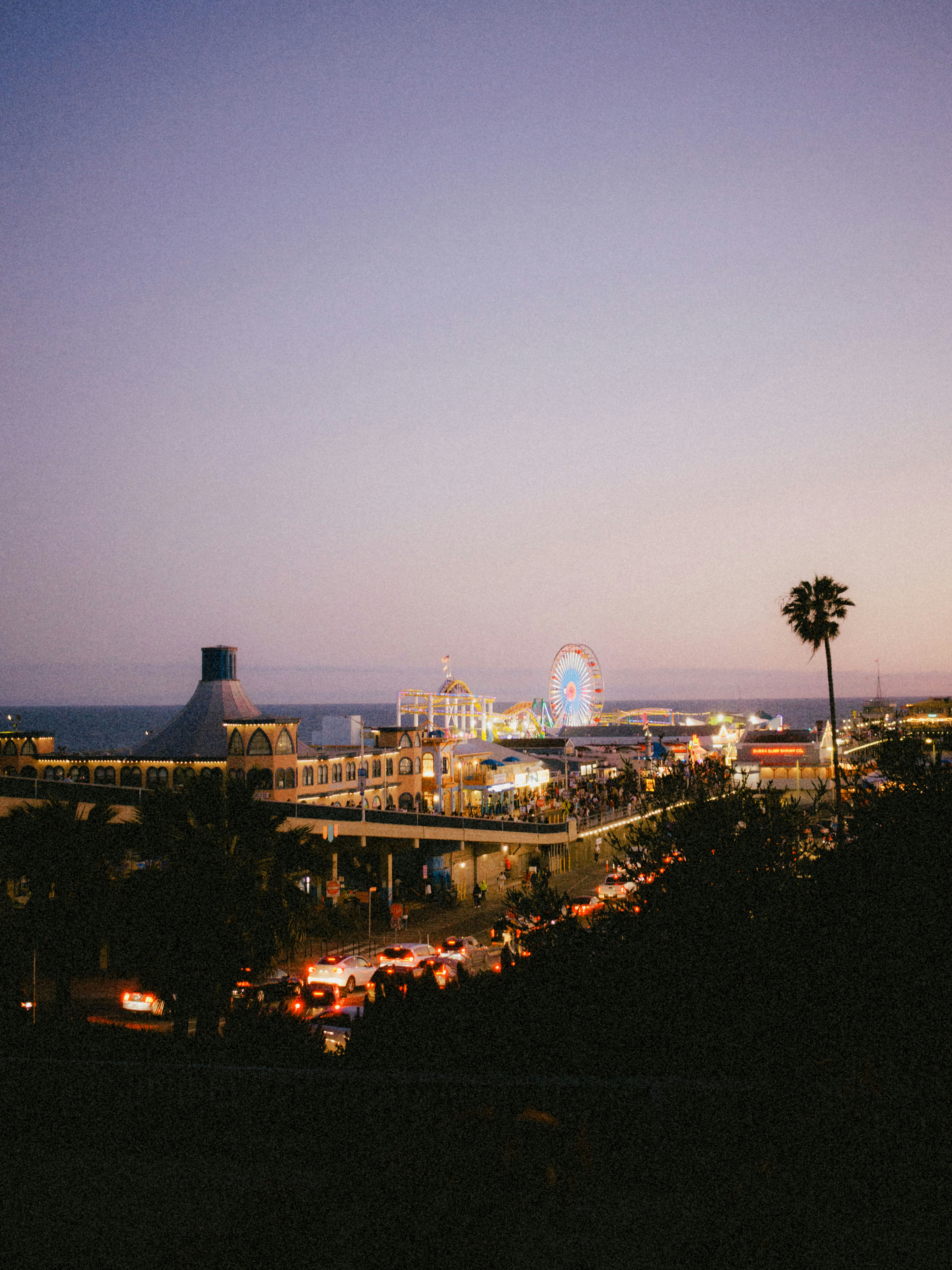 A view of a city at night from a hill