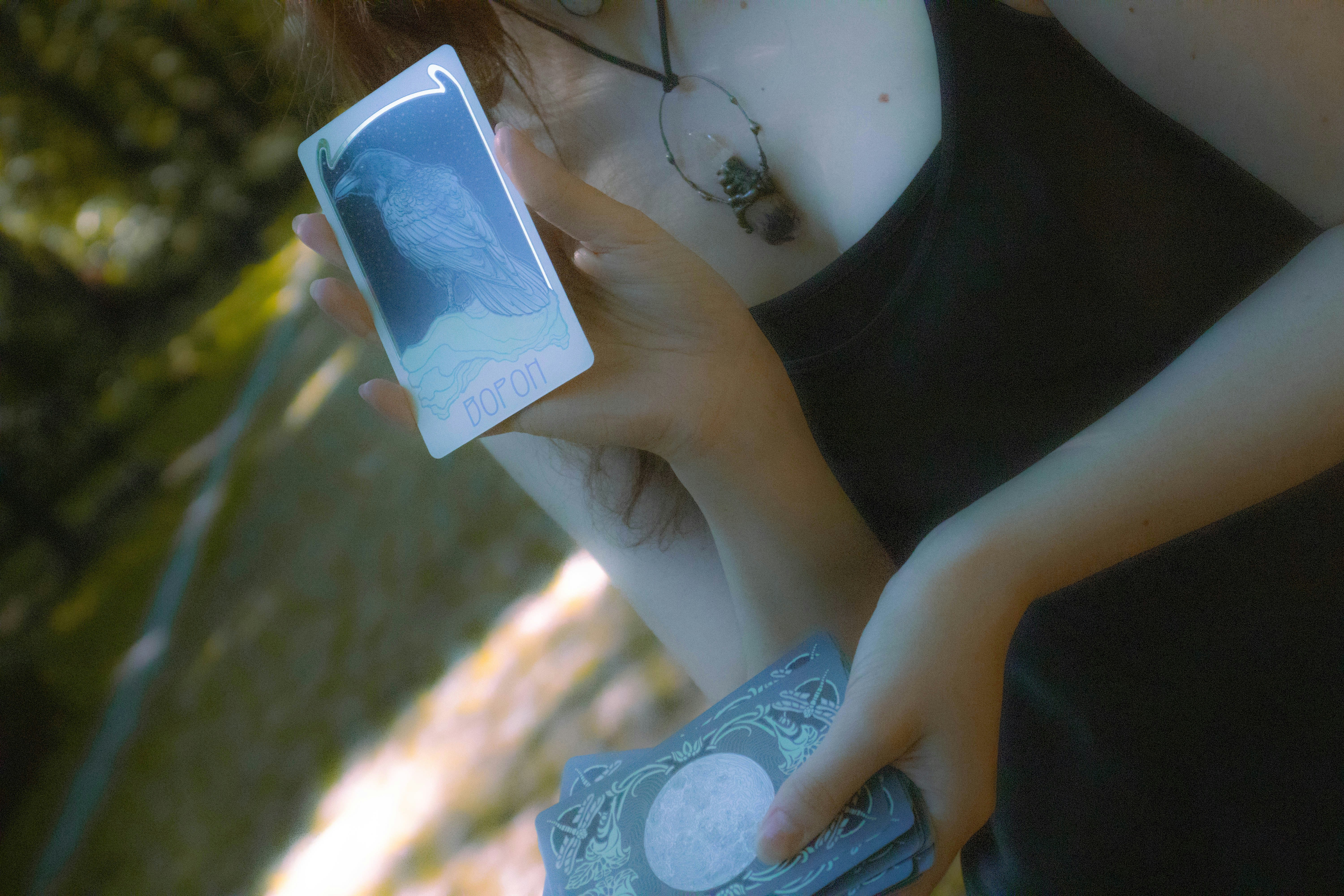 A woman holding a cell phone in her hand