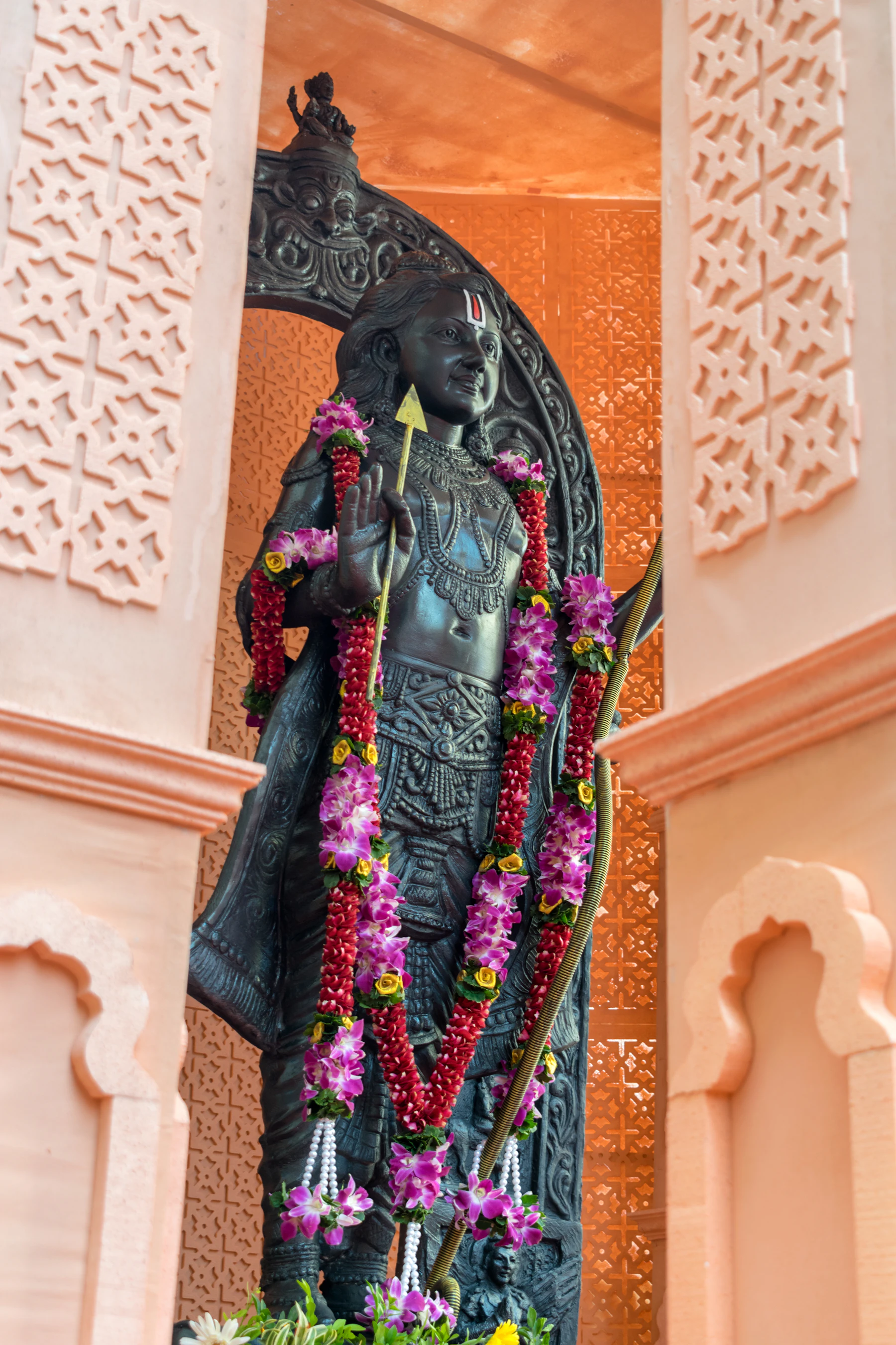 Temple deity draped in marigold
