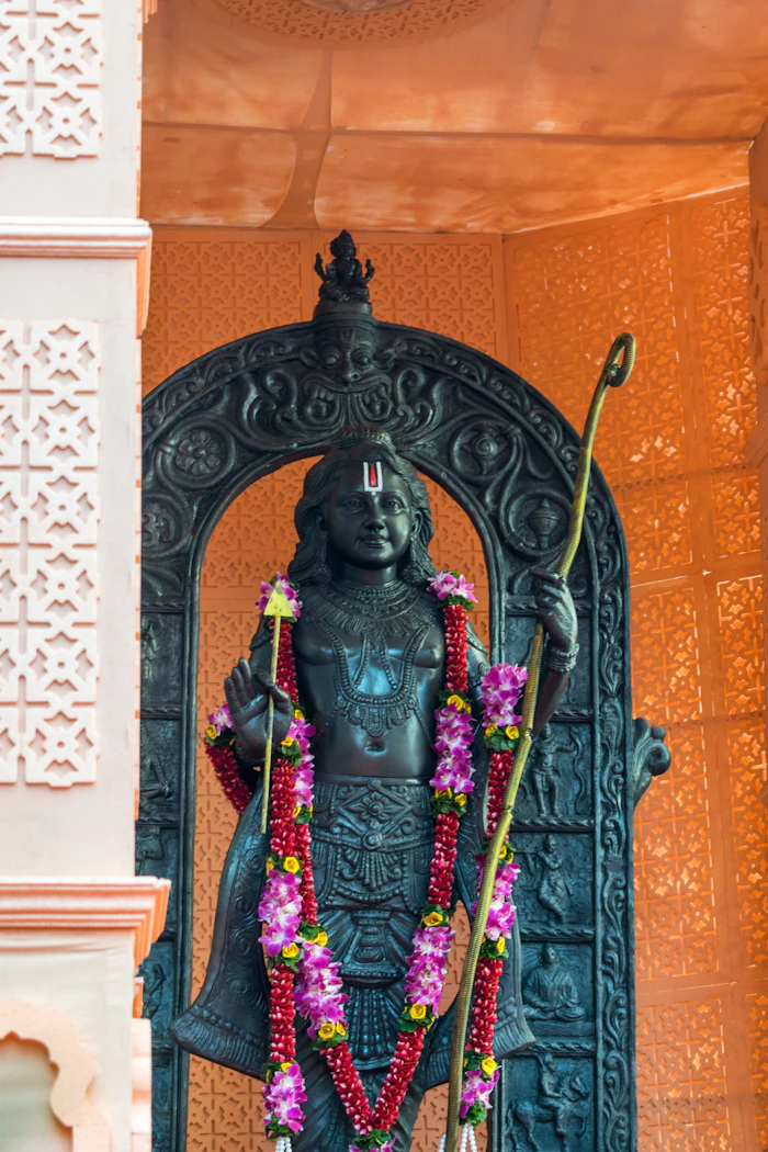 Devotional statue with flower garland