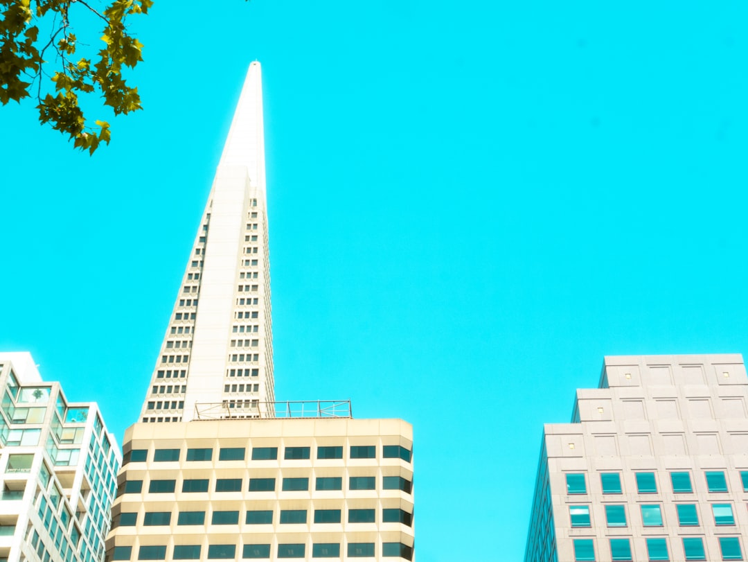 A group of tall buildings sitting next to each other,