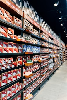 A store filled with lots of shelves filled with cakes