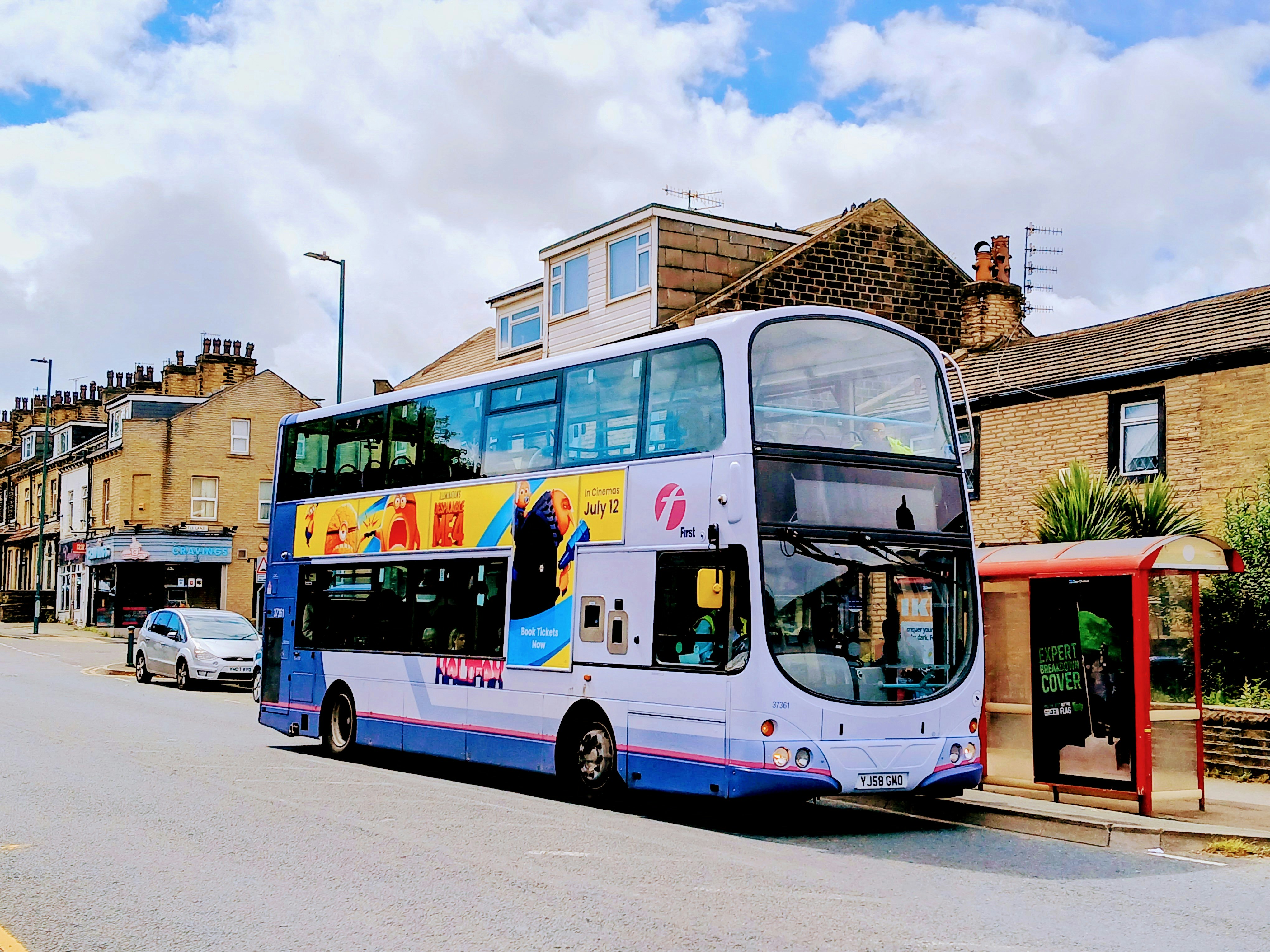 A double decker bus parked on the side of the road