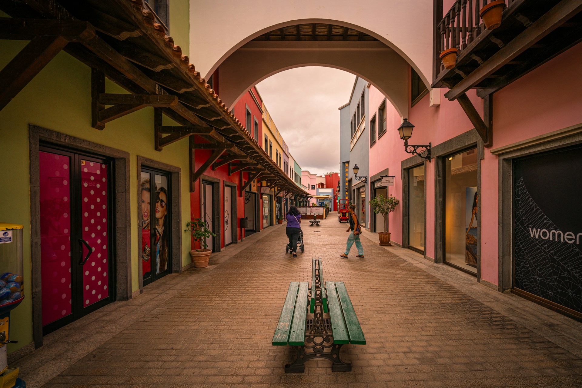 A bench sitting in the middle of a street