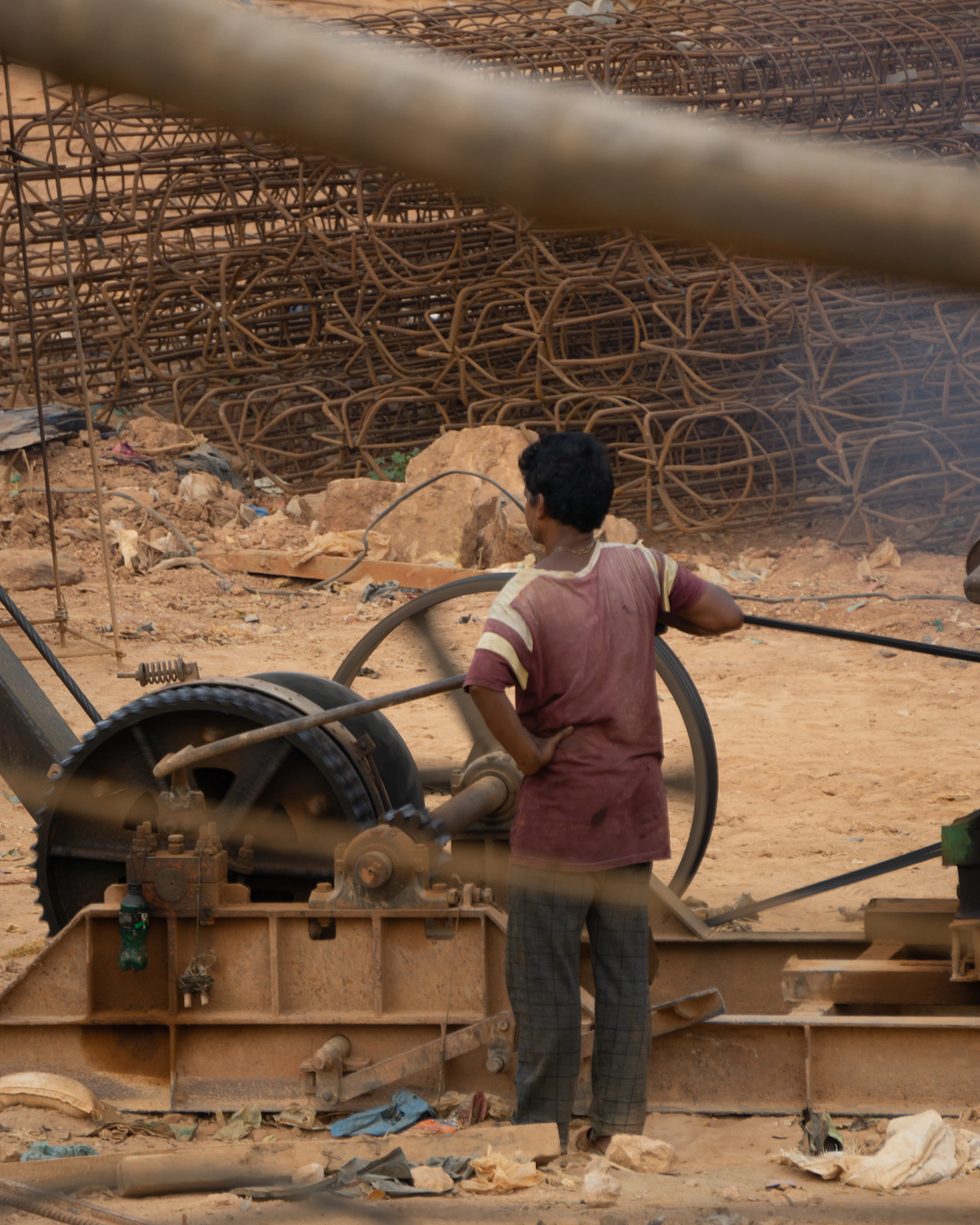 Indian engineer on a construction site in safety gear