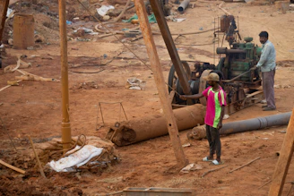 A group of people standing around a construction site
