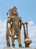 A statue of a man holding a staff