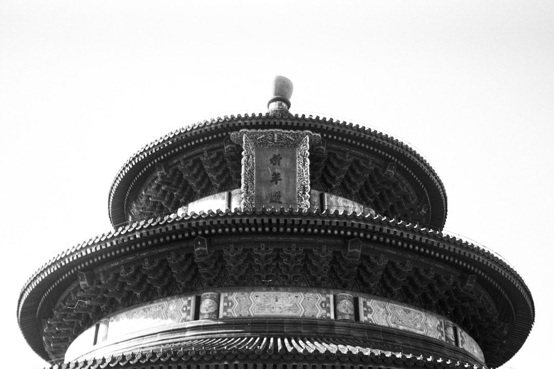 A black and white photo of a tall tower,