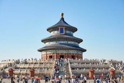 A group of people standing in front of a building