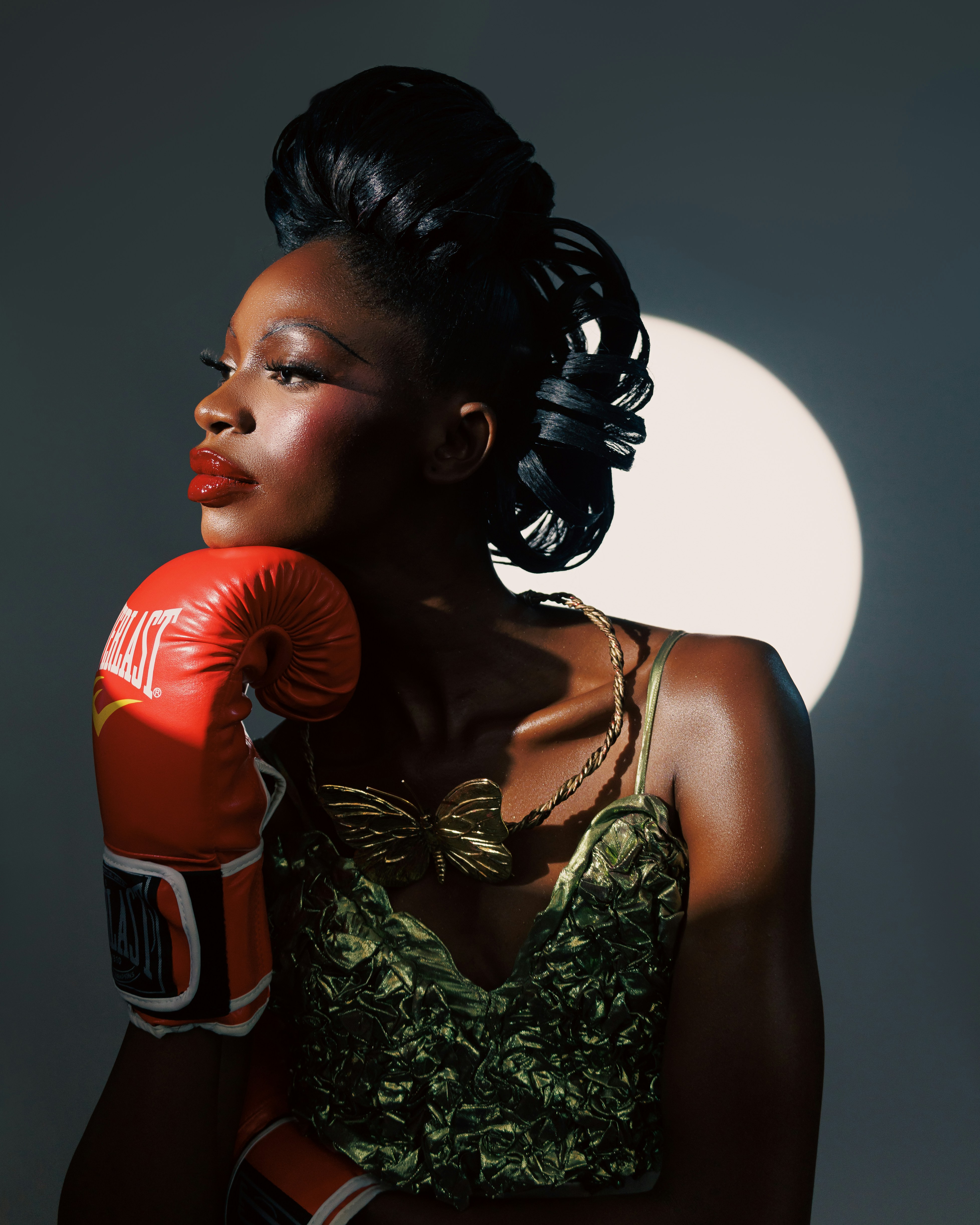A woman in a green dress and red boxing gloves photo  Free Sport Image on  Unsplash