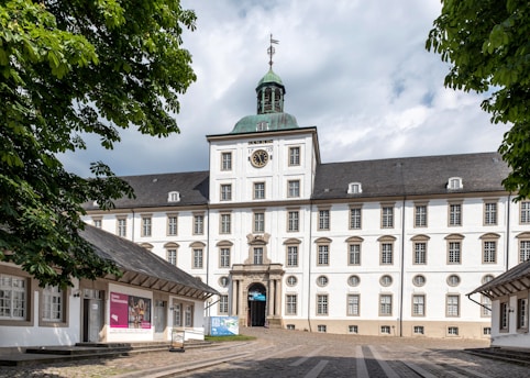 A large white building with a clock tower