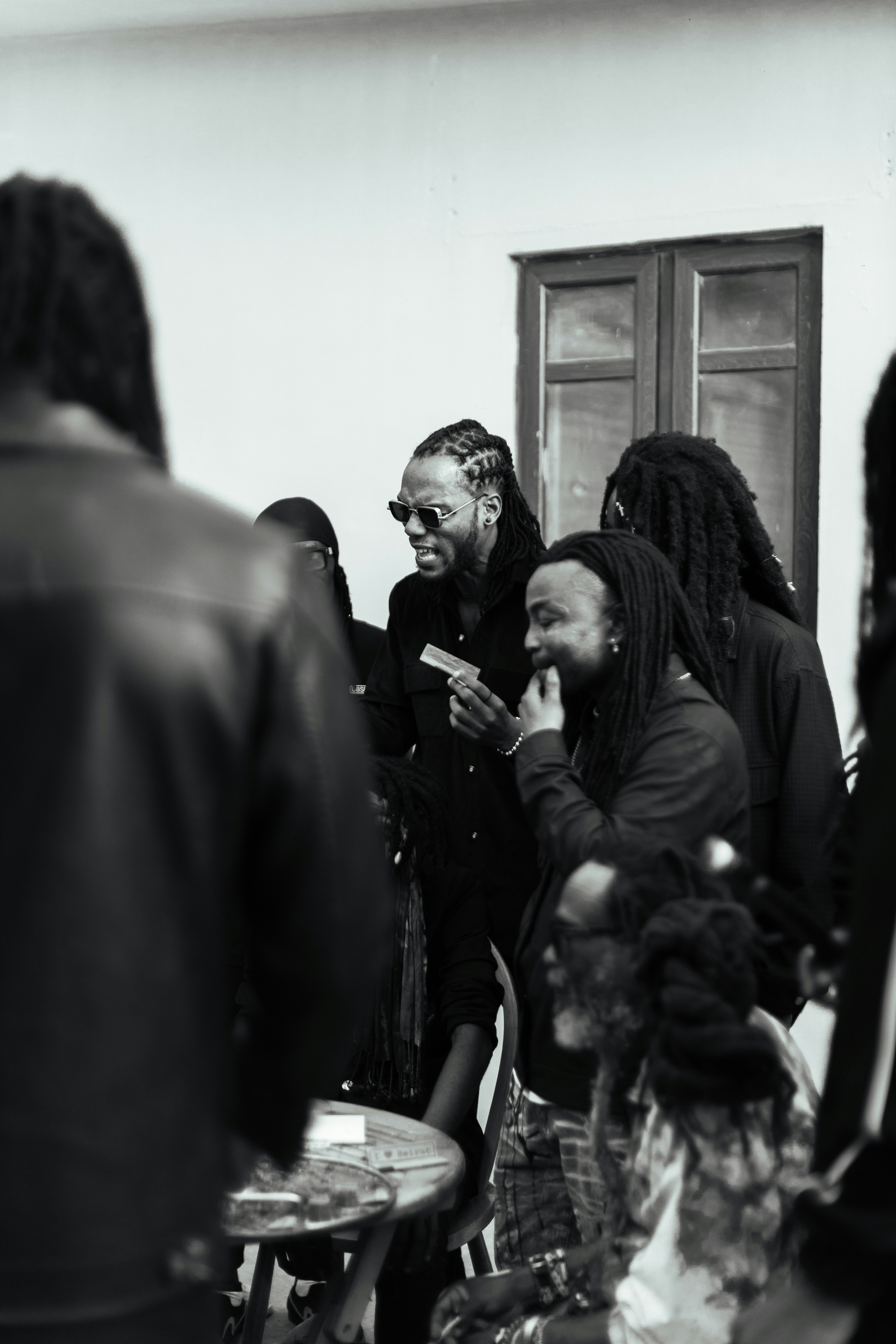 A group of people standing around each other