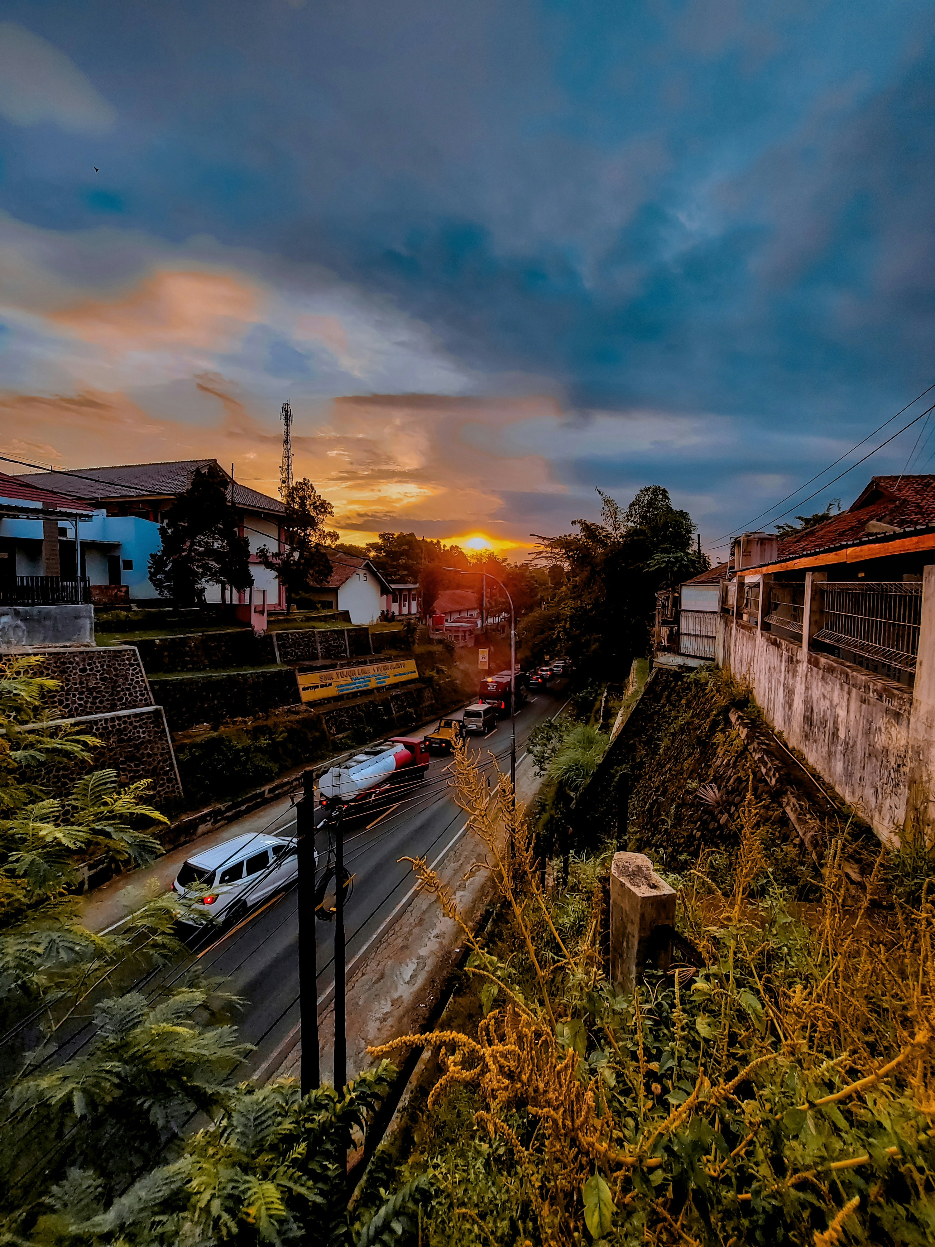 The sun is setting over a city street