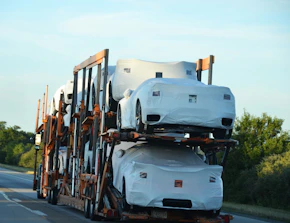 A truck with a bunch of cars on the back of it