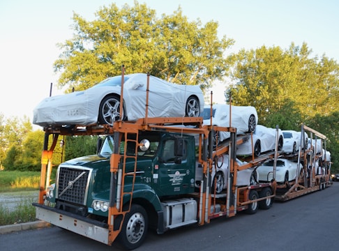A truck with a car on the back of it