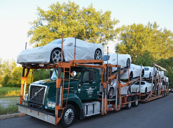 A truck with a car on the back of it
