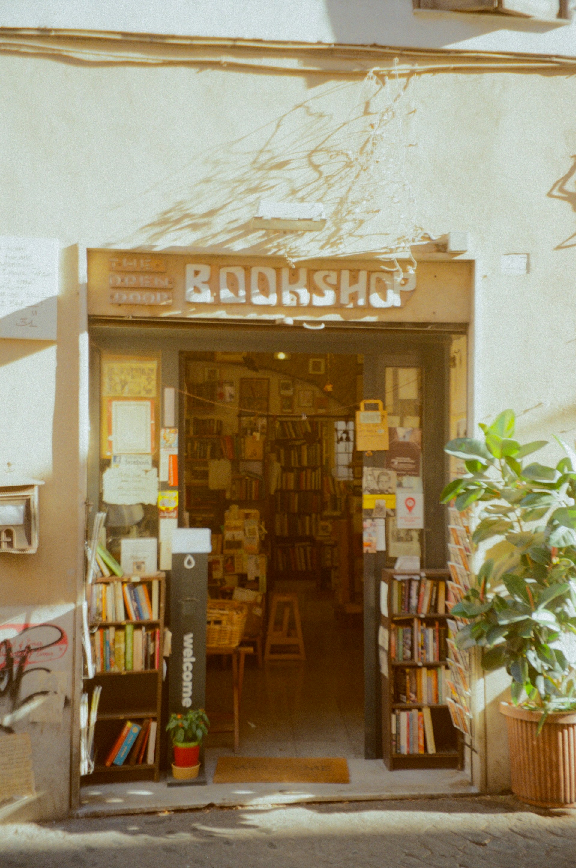 A bookshop with a lot of books on the front of it