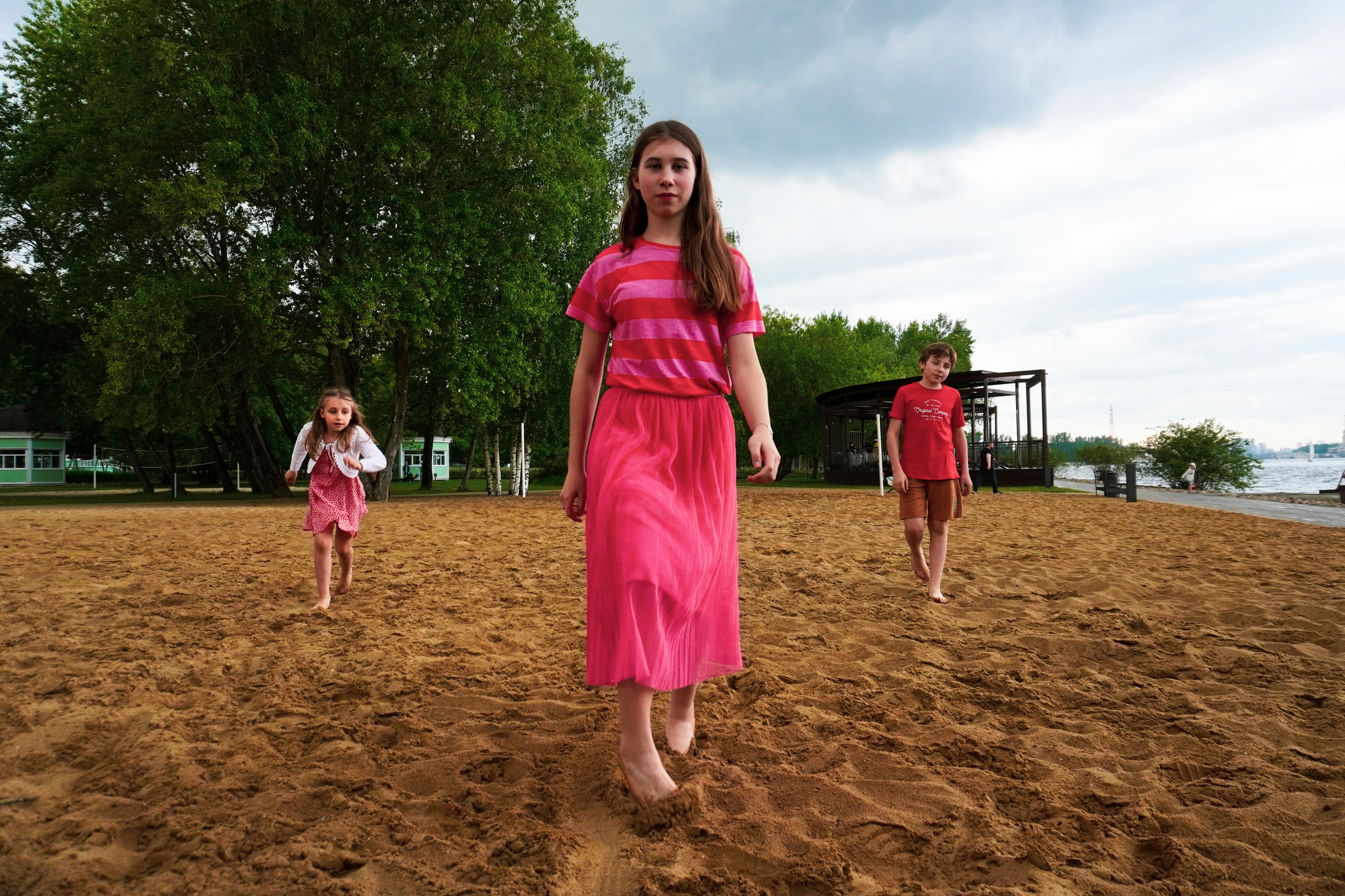 On the beach 🏖️ I have taken this photo on the city’s beach. We had a plan to have a picnic. But suddenly there was rain, lightning and thunder. I made this photo in short break before the storm. Kids were playing on empty sand, because everyone went or hided from the rain.