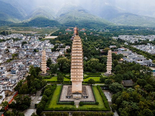 An aerial view of a city with a tall tower