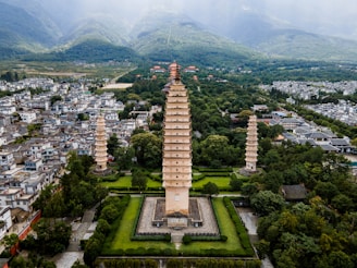 An aerial view of a city with a tall tower