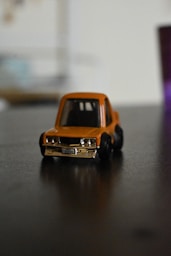 A toy car sitting on top of a table