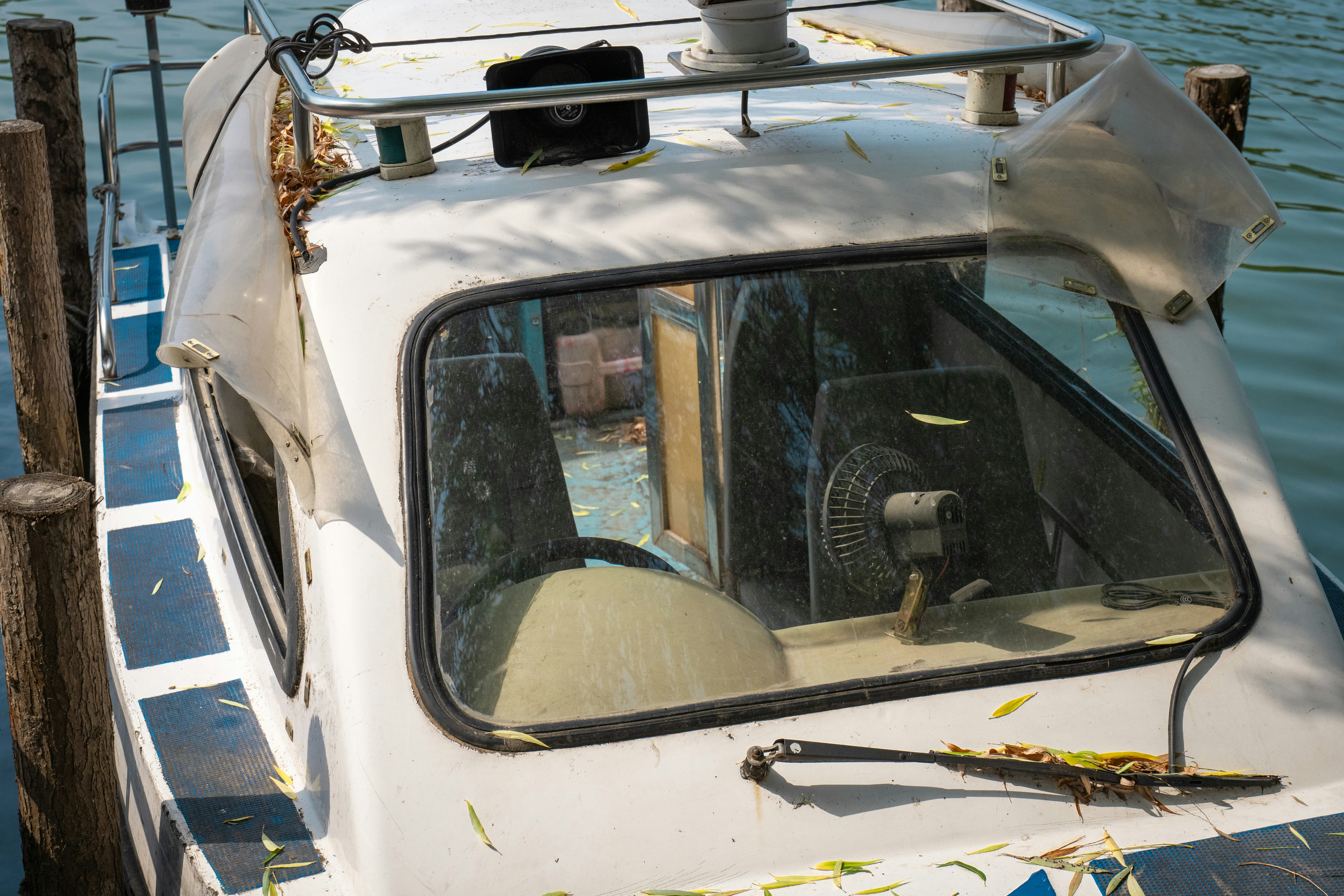 Electric car with front-end damage parked in a modern collision repair shop