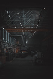 A dark room with lots of machines and lights