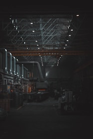 A dark room with lots of machines and lights