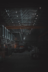 A dark room with lots of machines and lights