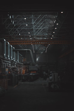 A dark room with lots of machines and lights