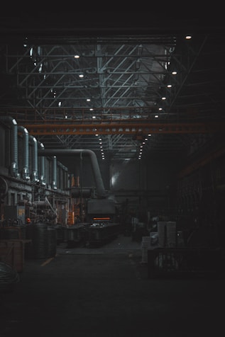 A dark room with lots of machines and lights