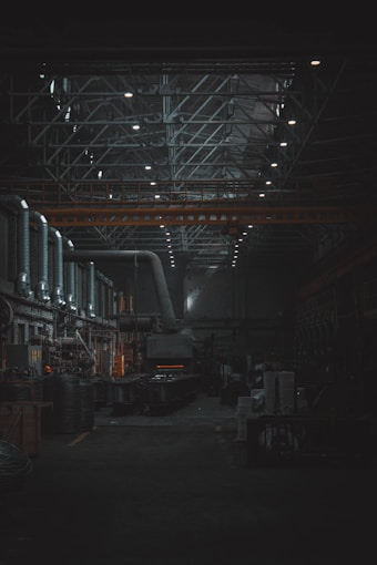 A dark room with lots of machines and lights